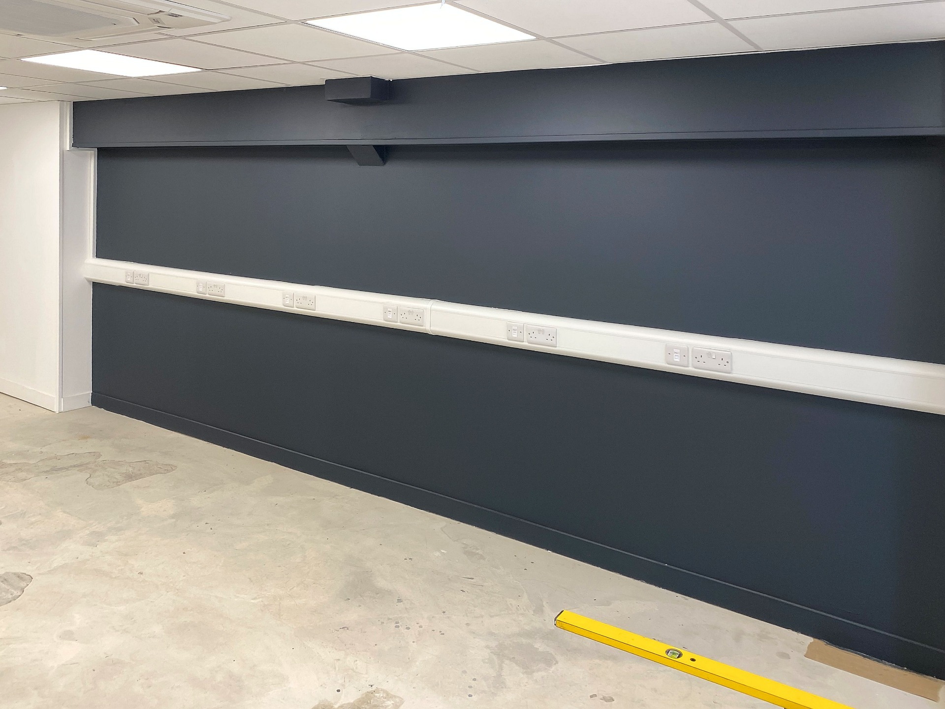 Shop Refurbishment, Dado trunking for electrical and date with future wall paint Barnstaple North Devon