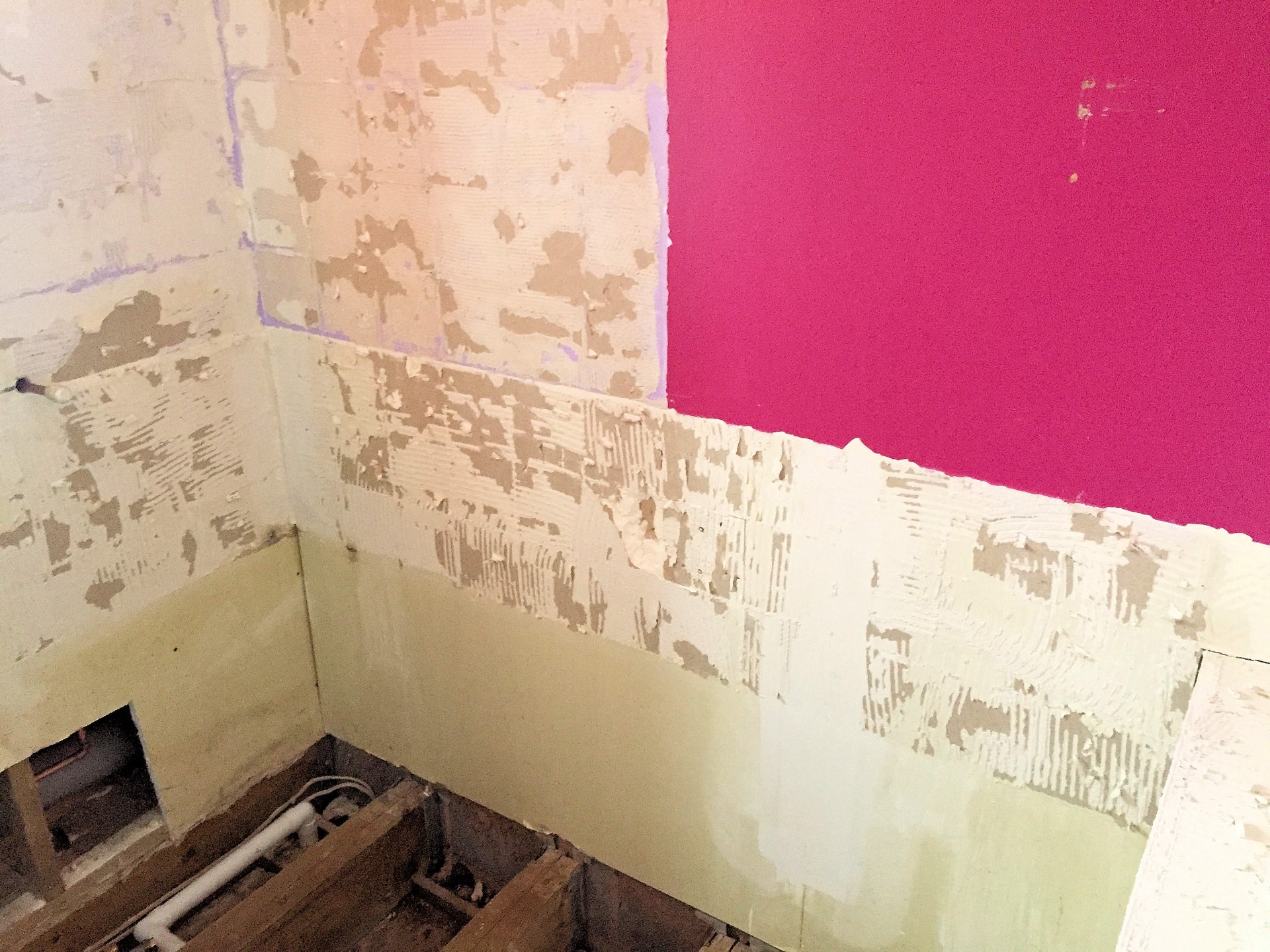 Old Bathroom wall coverings and tiles removed back to original surface. 