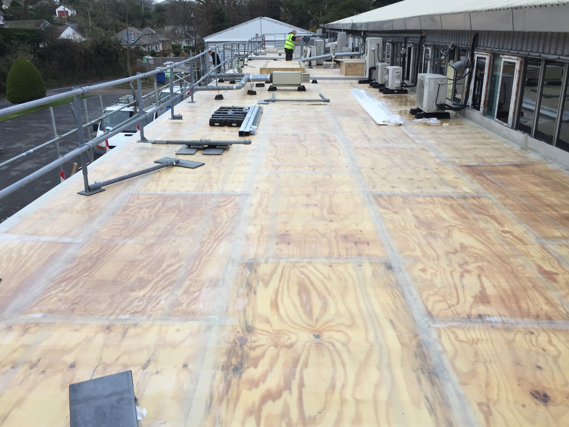 340m2 roof fiber-glassed and water tight in three weeks.   the Gel coat was later applied in sections to allow for moving around air units and other obstacles on the roof.  This was a very challenging project and by far not easy to complete with weather conditions and restriction on site, however the customer was happy the factory could continue throughout the working process. All work carried out by MJS Building Maintenance LTD.