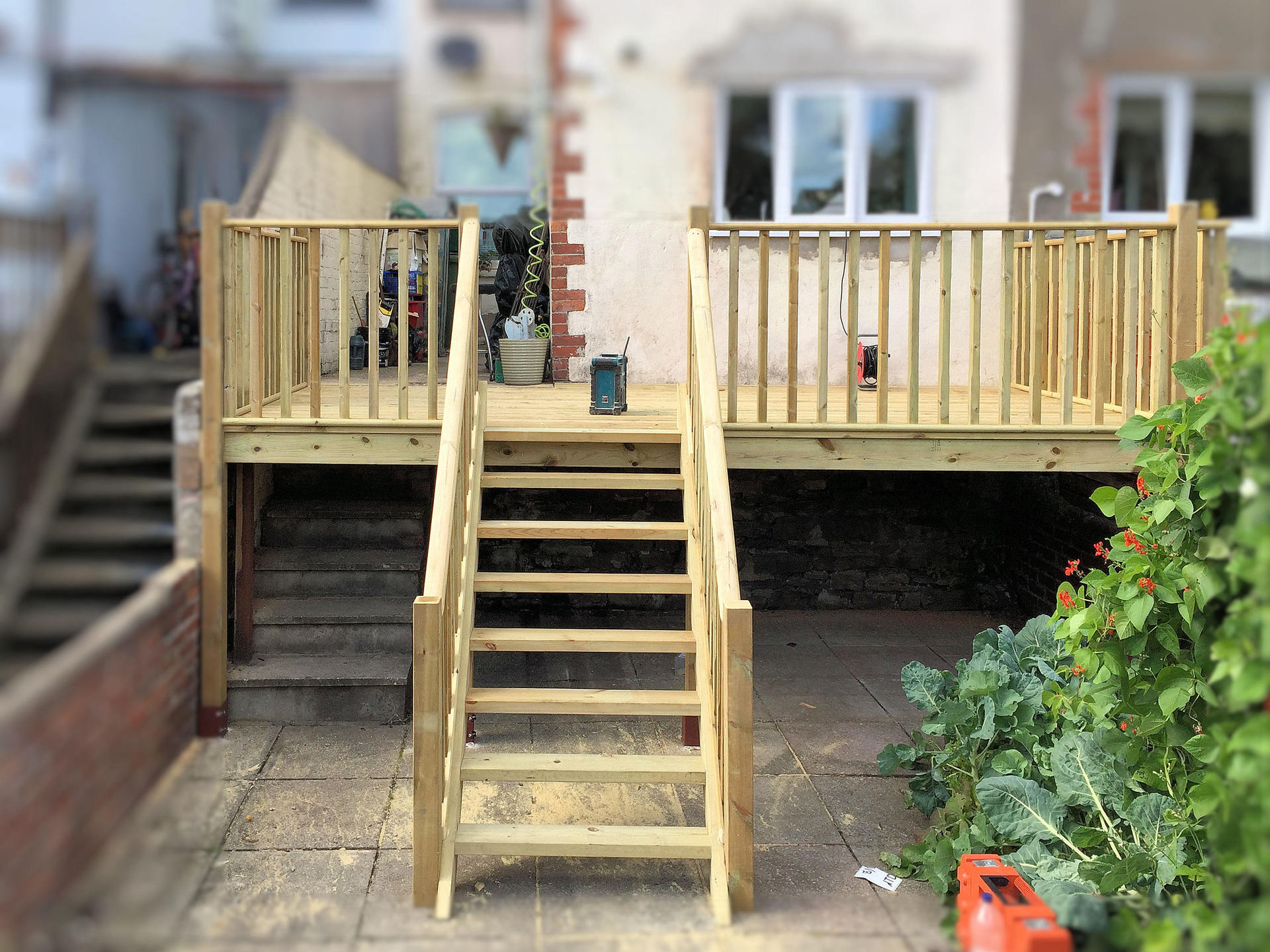 Decking completed, now with useable ground floor patio and staircase leading to garden