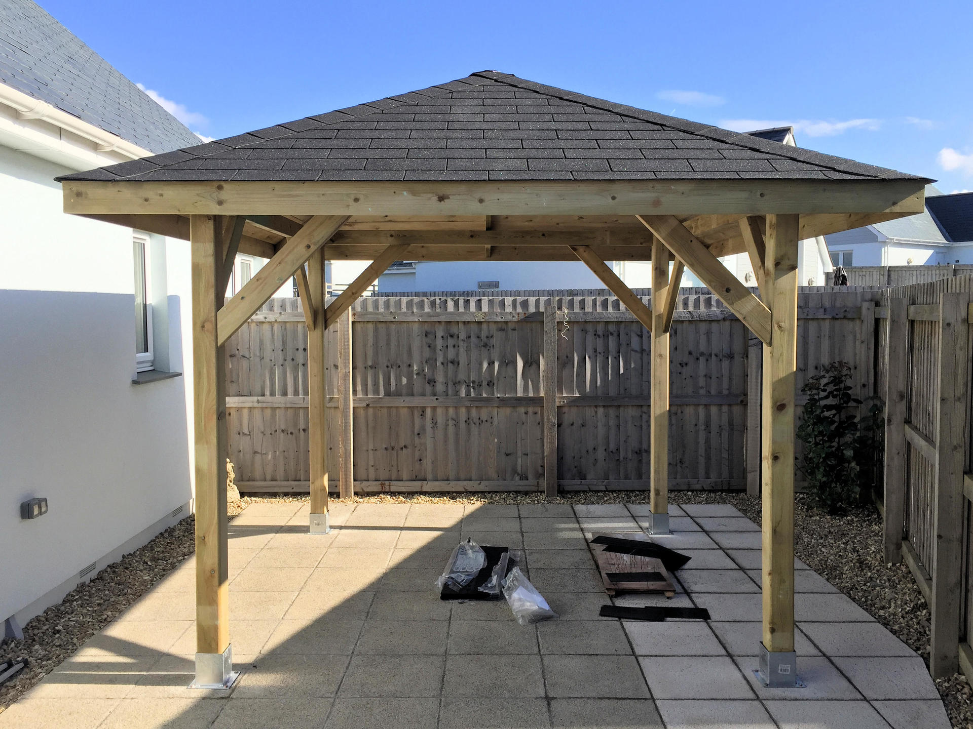 Gazebo complete and bolted to the ground using galvanized post shoe.