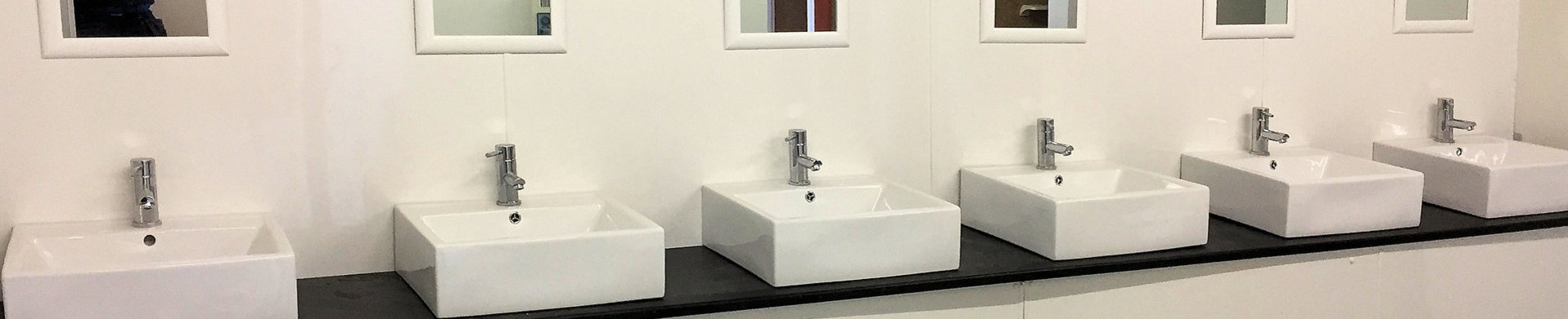 Camp site shower block with belfast sinks in bathroom installations