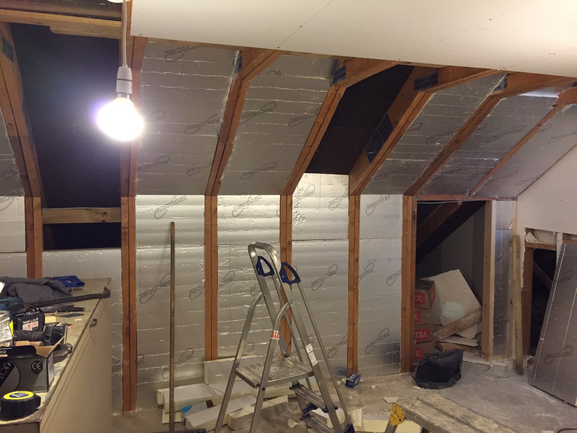 Loft installation of solid insulation between rafters and ceiling, new wiring for sockets and lights installed. MJS Building Maintenance Ltd.