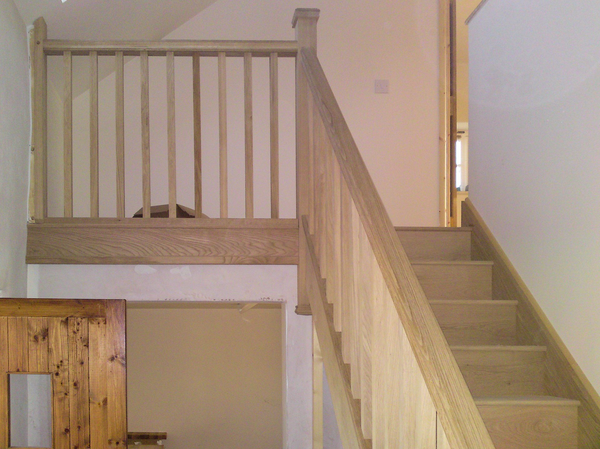 Staircase solid oak, with handrail and open spindles, also along landing. Barnstaple North Devon