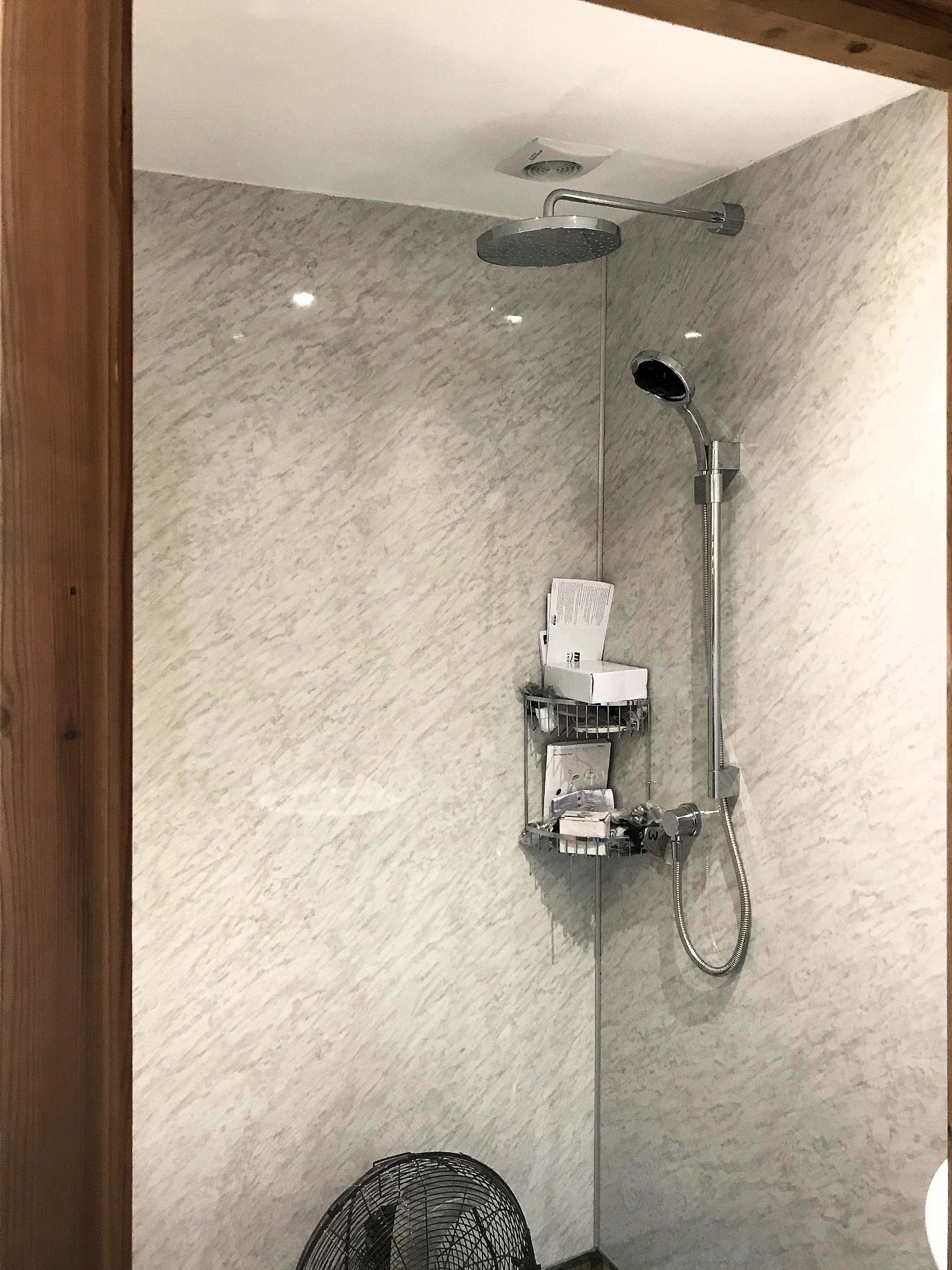 Bluetooth wireless digital controlled shower fitted with hose and round fixed chrome drencher head. Barnstaple North Devon
