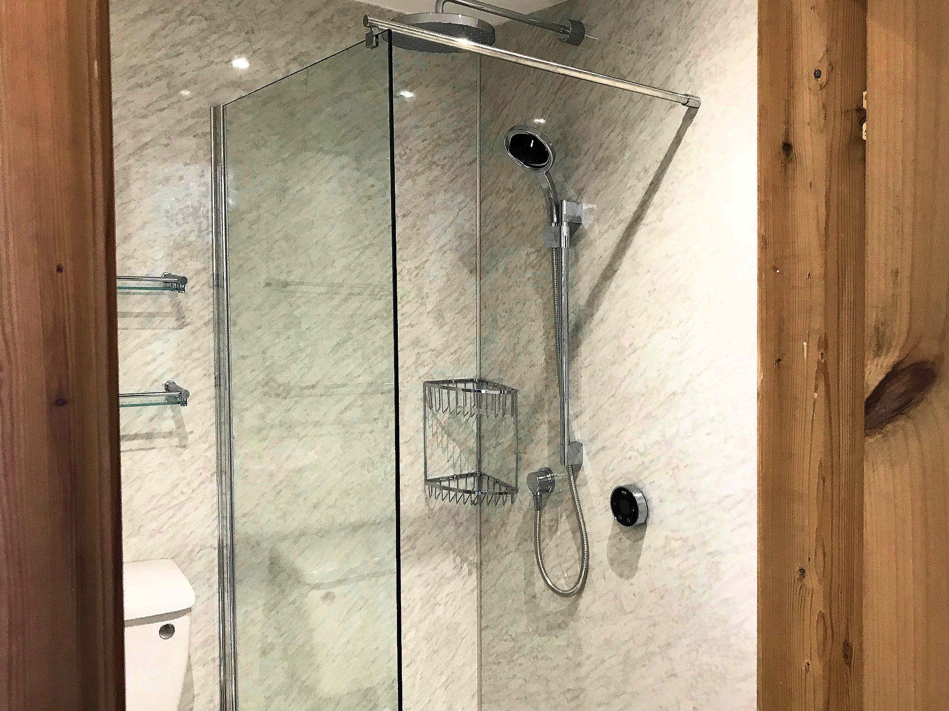 New WC, a digital controlled shower drench shower, vertical towel rail with matching wall fixtures shelves and baskets. Barnstaple North Devon