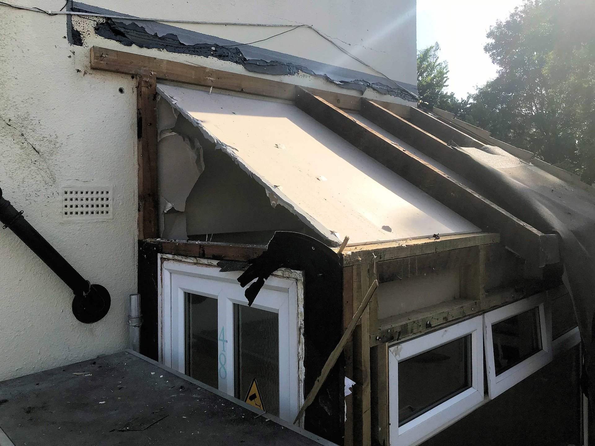 Removal and demolition of substandard porch. North Devon