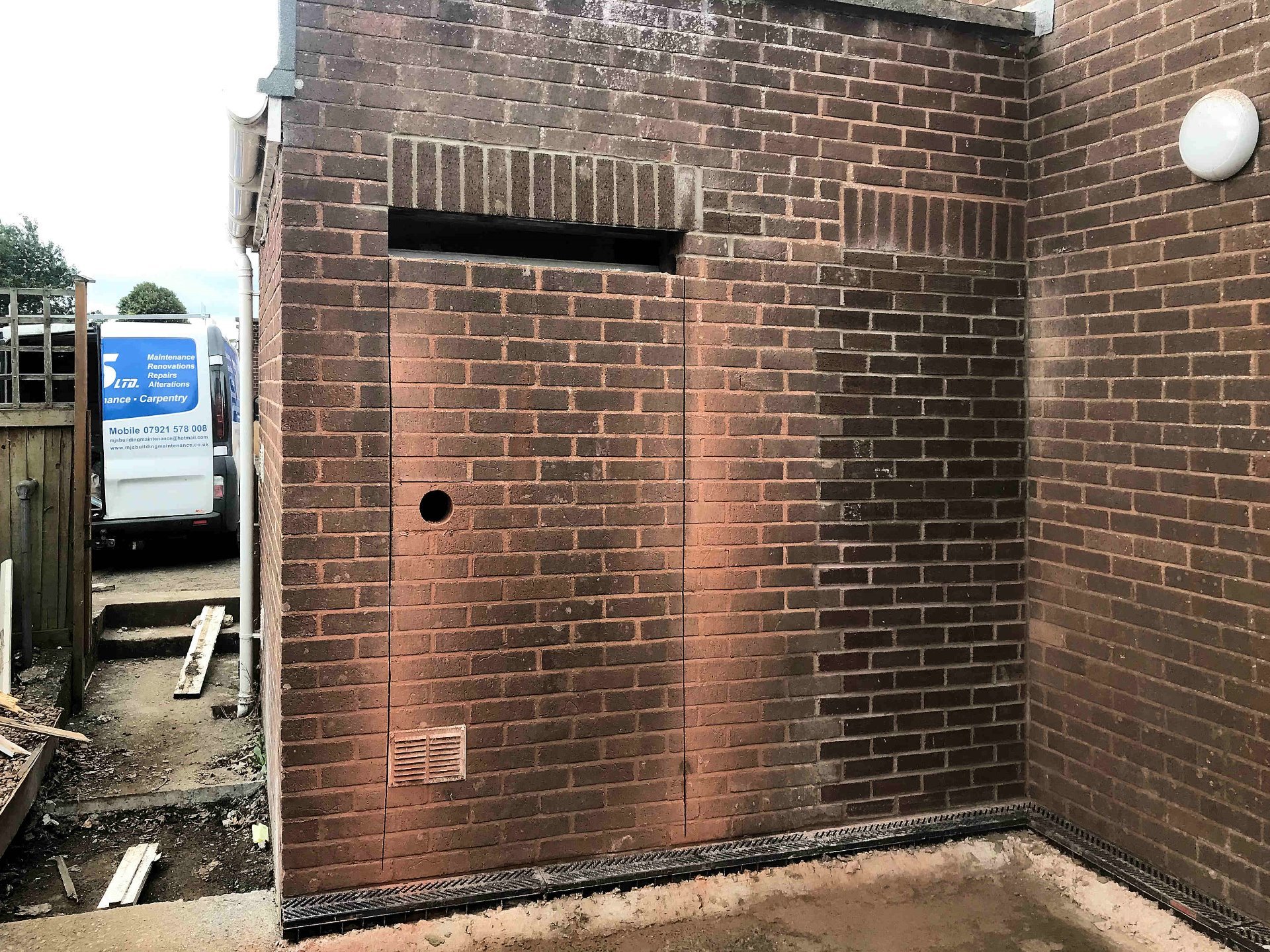 Old doorway bricked up. new door way marked out, Lintel install with brick on edge header. North Devon