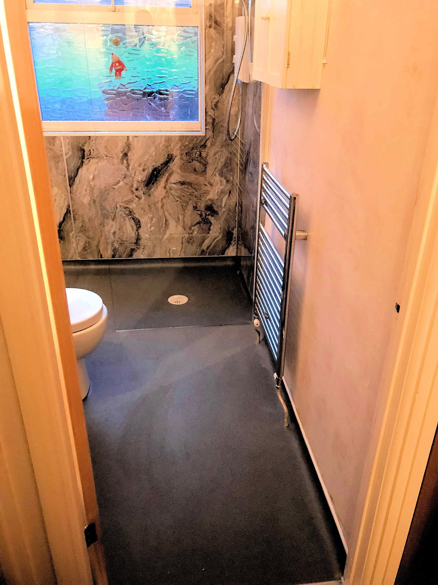 Bathroom to walk in shower room, chrome towel radiator. Barnstaple North Devon