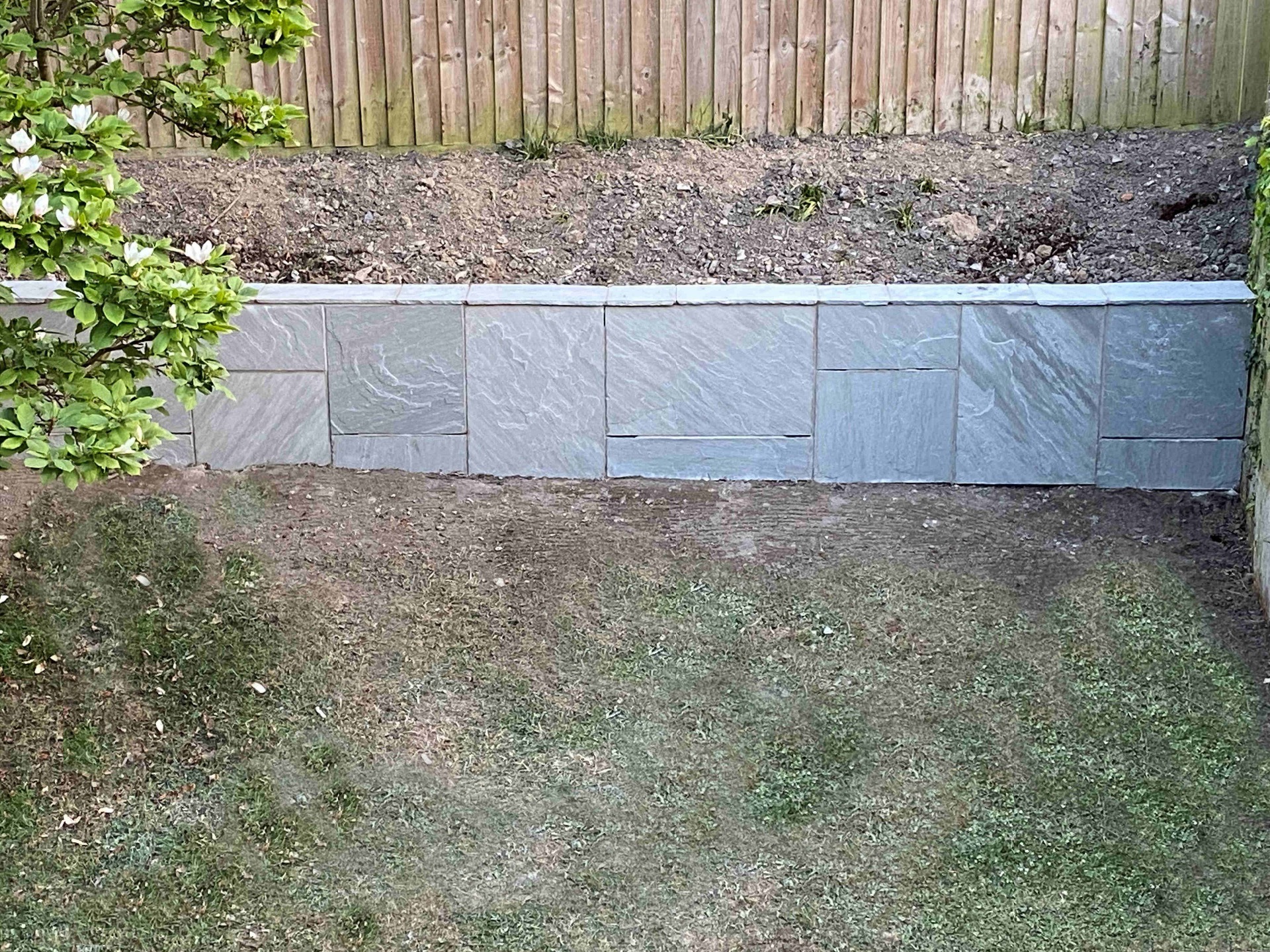 Patio Wall Path. Top of retaining wall capped with Indian sandstone. Barnstaple North Devon