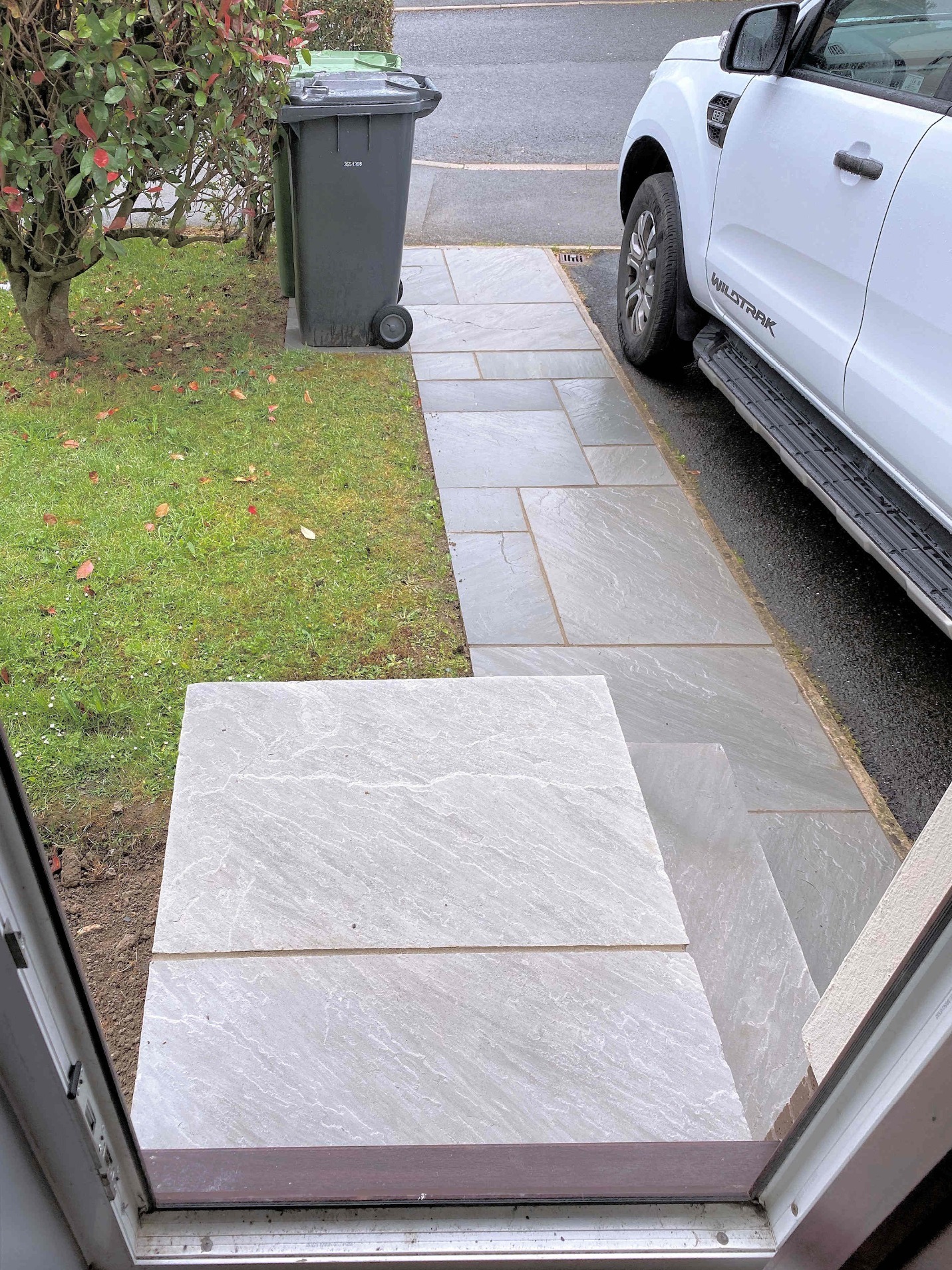 Patio Wall Path. Indian sandstone slabs laid on full mortar bed to allow to extend the drive. Barnstaple North Devon